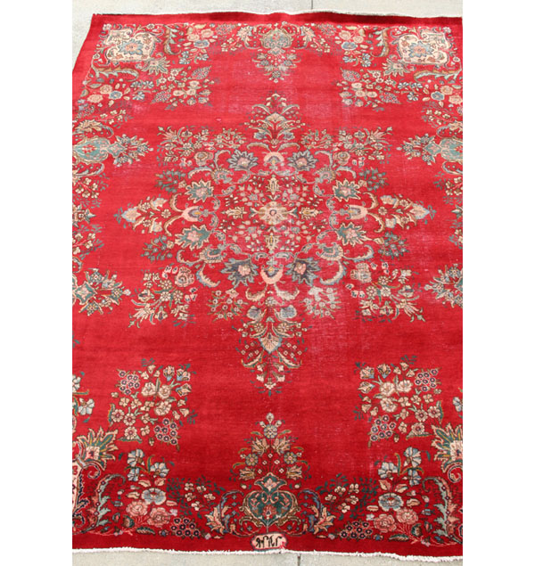 Appraisal: Vintage hand loomed Oriental area rug with a floral border