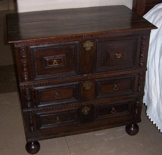 Appraisal: A late th Century oak chest fitted three drawers with