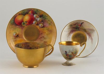 Appraisal: Two Royal Worcester cups and saucers one painted with fruit