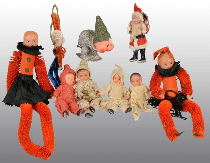 Appraisal: Lot of Halloween Christmas Dolls Description Includes four dolls two