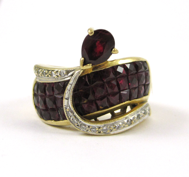 Appraisal: RUBY DIAMOND AND EIGHTEEN KARAT GOLD RING with faceted rubies