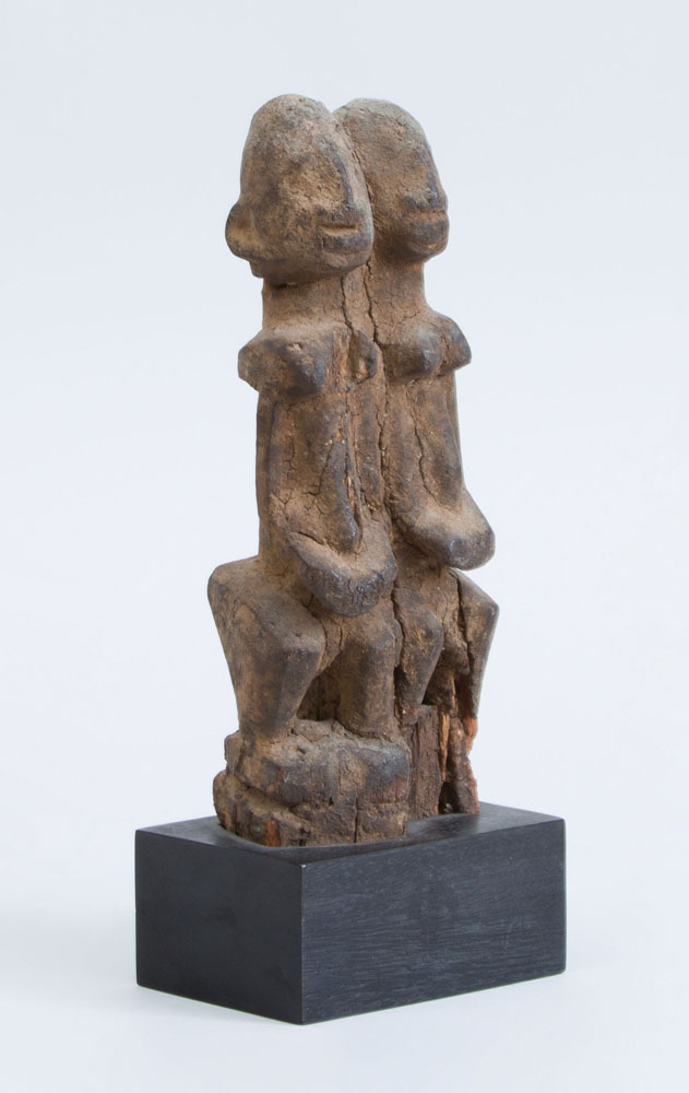 Appraisal: AFRICAN CARVED HARDWOOD MODEL OF A DOGON COUPLE Noted fitted