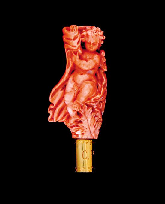 Appraisal: Victorian carved coral and gold brooch th century cherub enveloped