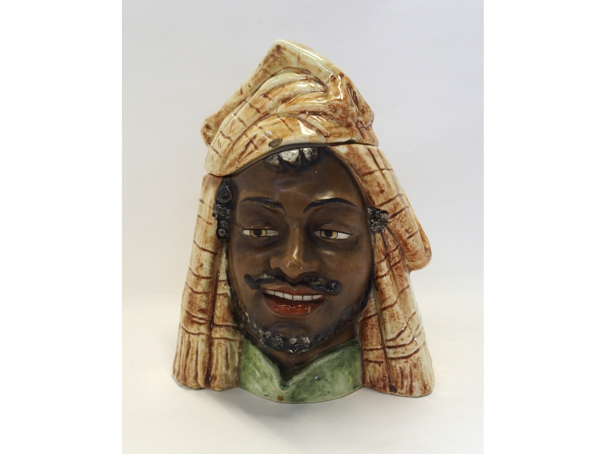 Appraisal: Pottery tobacco jar modelled as an Arabic man