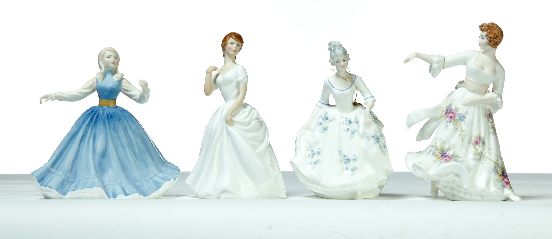 Appraisal: FOUR ROYAL DOULTON LADY FIGURINES England rd quarter- th century