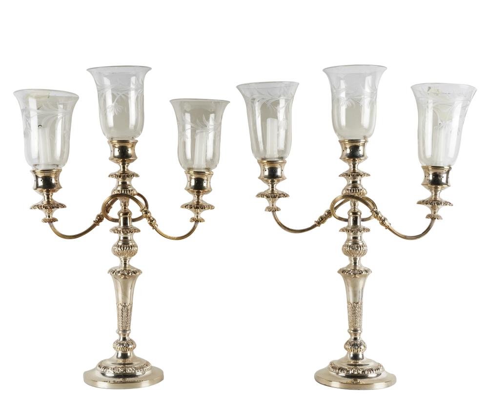 Appraisal: PAIR OF SILVERPLATE THREE-LIGHT CANDELABRAunmarked with etched glass hurricane shades