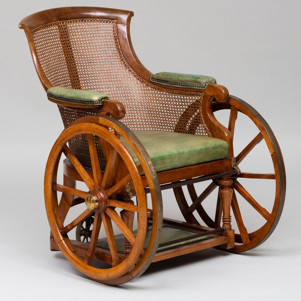 Appraisal: Victorian Bleached Mahogany Caned and Leather Wheel Chair Fitted with