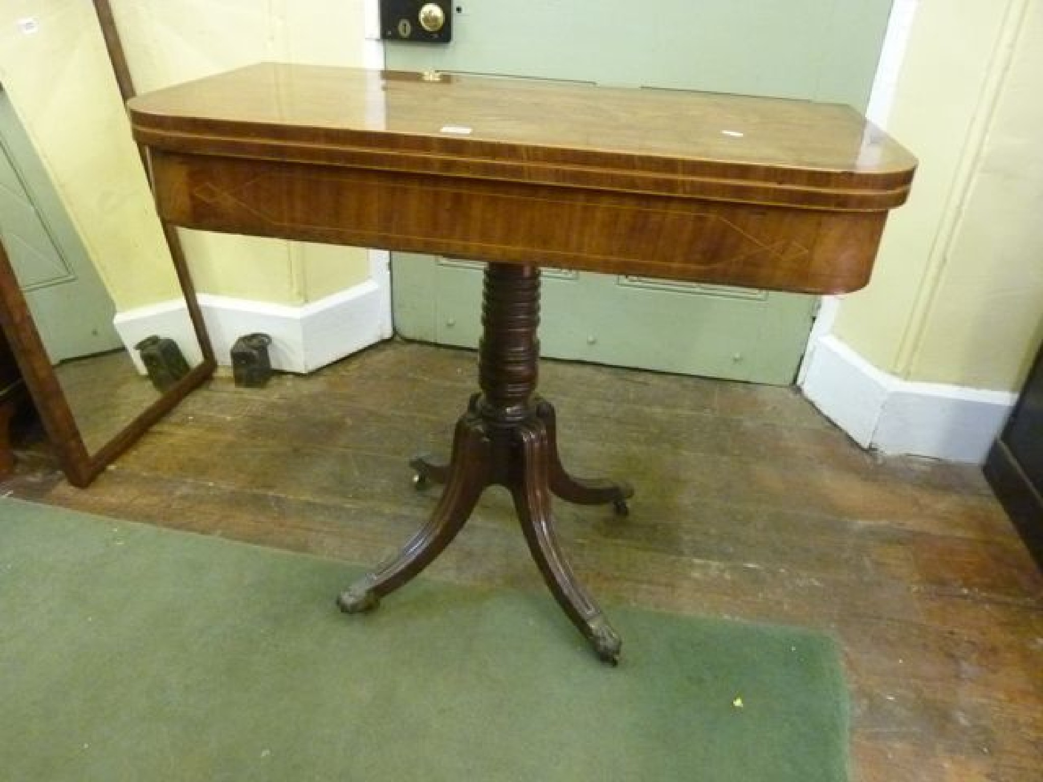 Appraisal: A Regency mahogany D-end fold over top tea table with