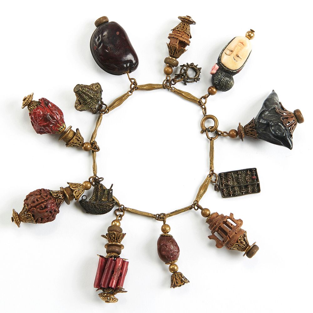 Appraisal: Chinese Charm Bracelet w Carved Nuts Lovely charm bracelet from