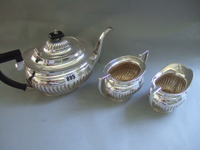 Appraisal: A plated three piece tea set comprising a teapot a