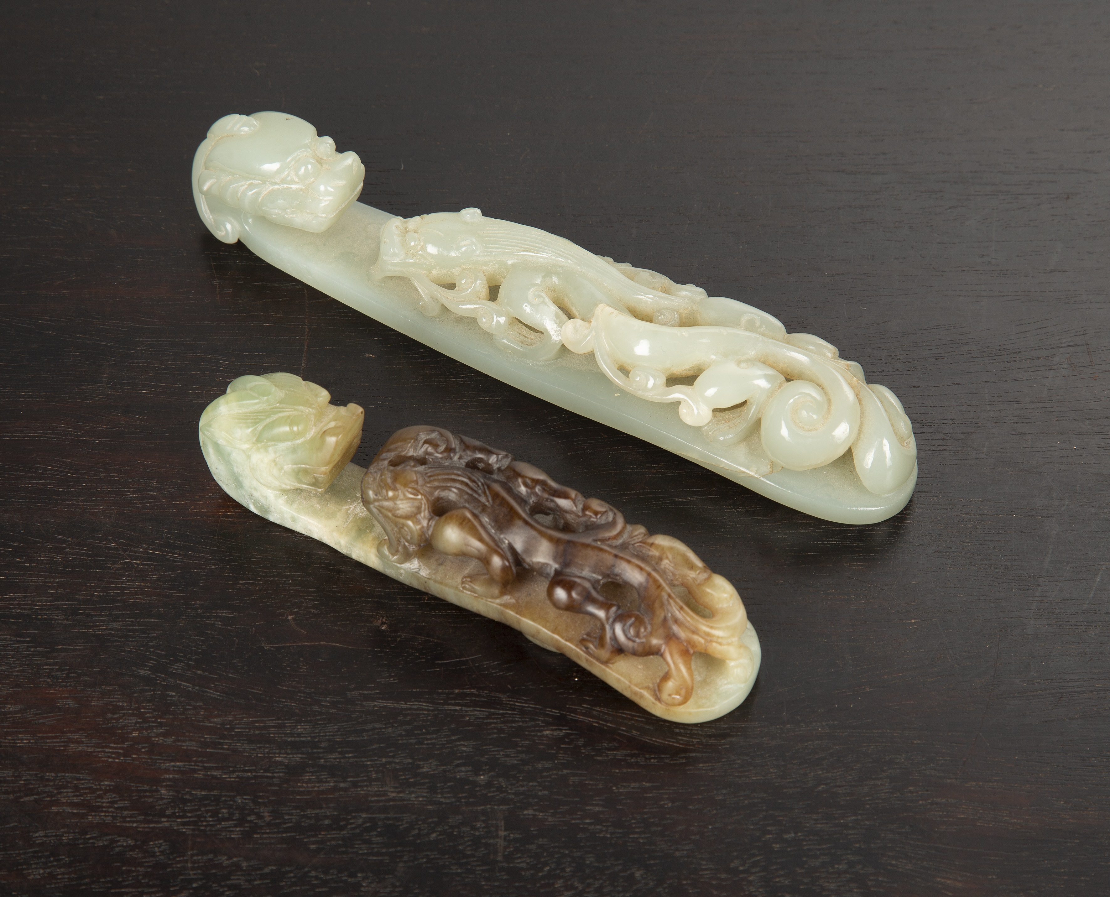 Appraisal: Two jade belt hooksChinese th Century comprising of a white