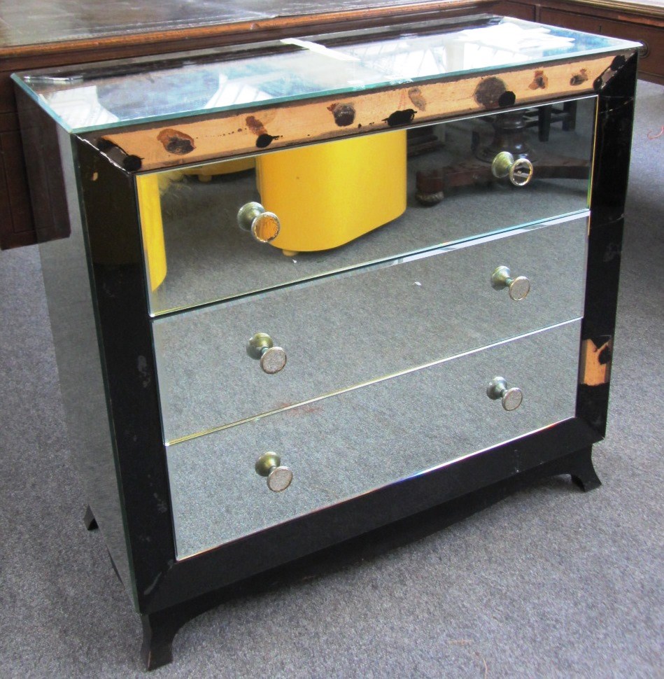 Appraisal: A mid th century French mirrored three drawer commode on