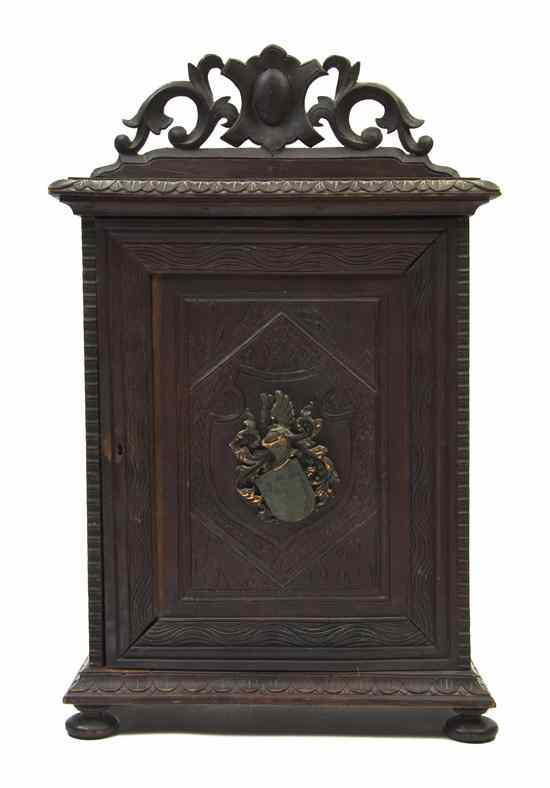 Appraisal: A Carved Mahogany Table Cabinet having a pierce carved crest