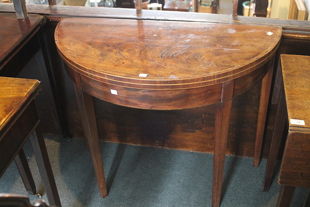 Appraisal: A GEORGE III MAHOGANY HALF ROUND FOLD OVER CARD TABLE