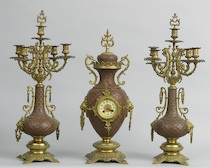 Appraisal: A French Bronze Clock Garniture Set A French bronze clock