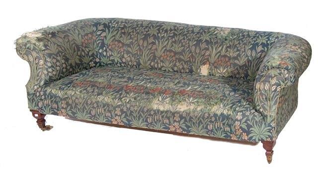 Appraisal: A VICTORIAN BUTTON UPHOLSTERED CHESTERFIELD and matching armchair covered in