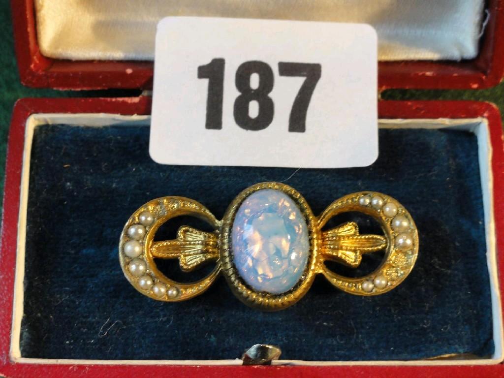 Appraisal: A bar brooch of stylised form with pearl and black