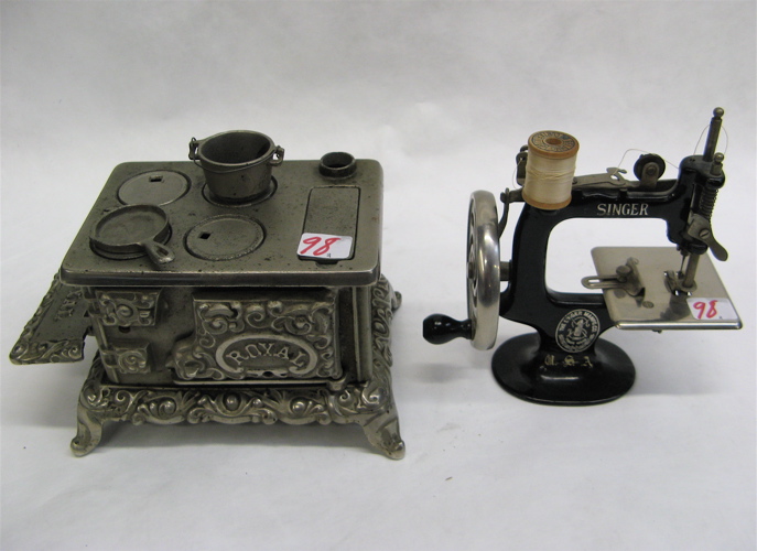 Appraisal: TWO AMERICAN CHILD'S PLAY TOYS miniature ornate iron cook stove