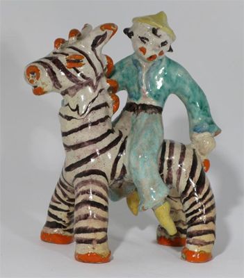 Appraisal: A German pottery figure group probably Walter Bosse painted in