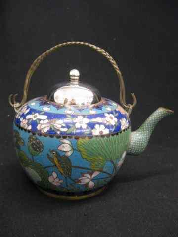 Appraisal: Oriental Cloisonne Teapot floral on blue field silver top swing