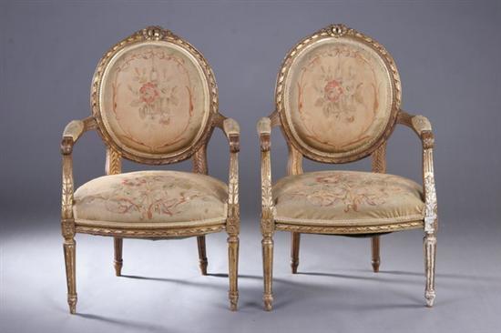 Appraisal: PAIR LOUIS XVI STYLE MEDALLION-BACK GILTWOOD FAUTEUILS circa - Crested