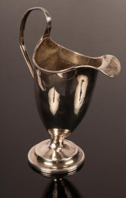 Appraisal: A George III helmet-shaped silver cream jug marks rubbed but