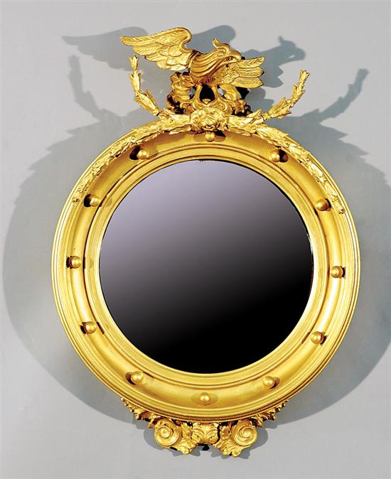 Appraisal: Georgian style carved giltwood bull's-eye mirror crest surmounted with bird