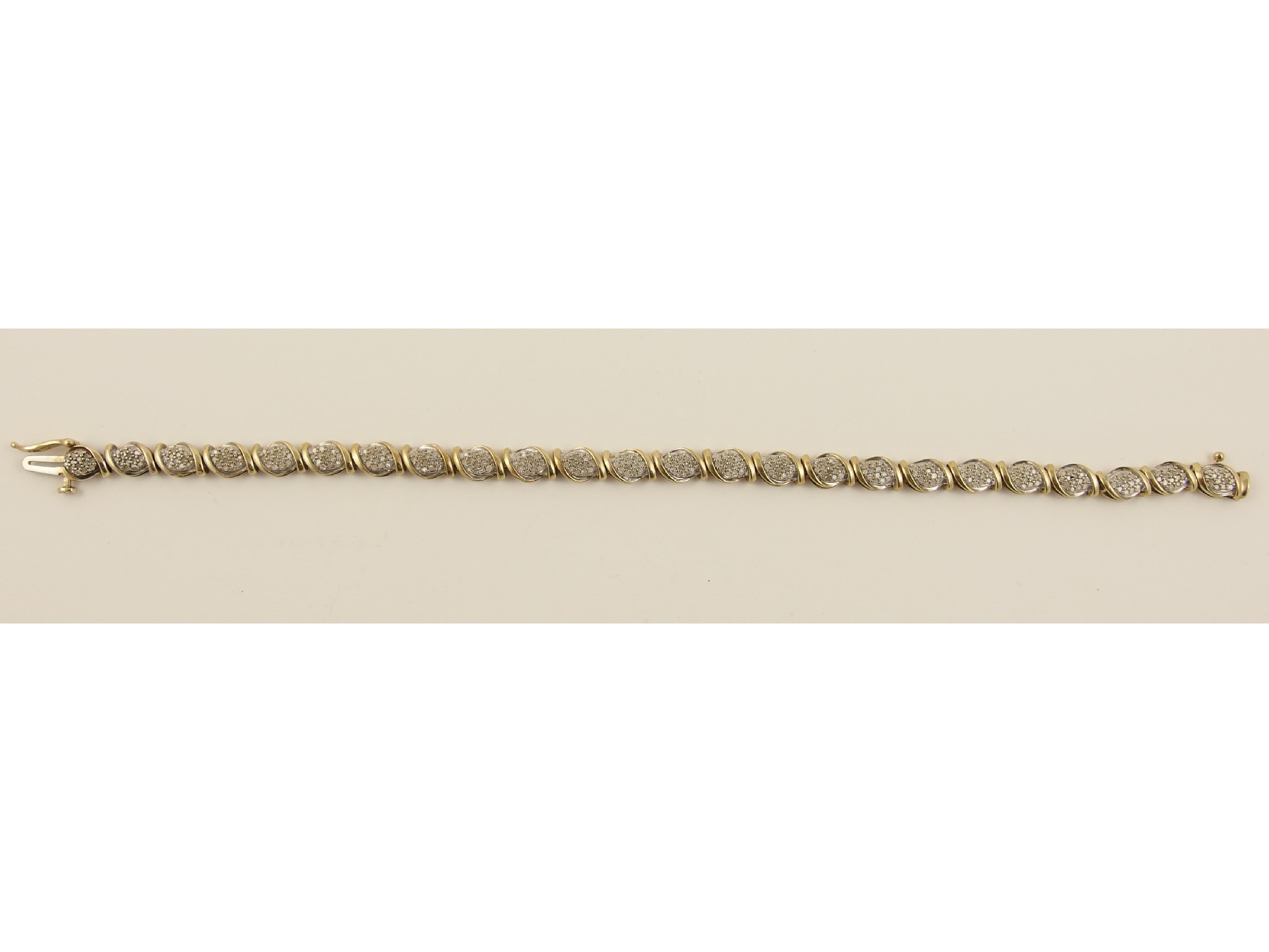 Appraisal: A ct diamond braceletin yellow gold the leaf shaped links