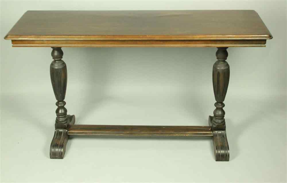 Appraisal: BAROQUE STYLE WALNUT LIBRARY TABLE having a long rectangular top