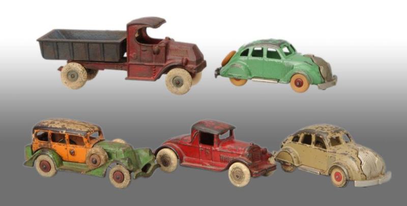 Appraisal: Lot of Cast Iron Vehicle Toys Description American Includes two