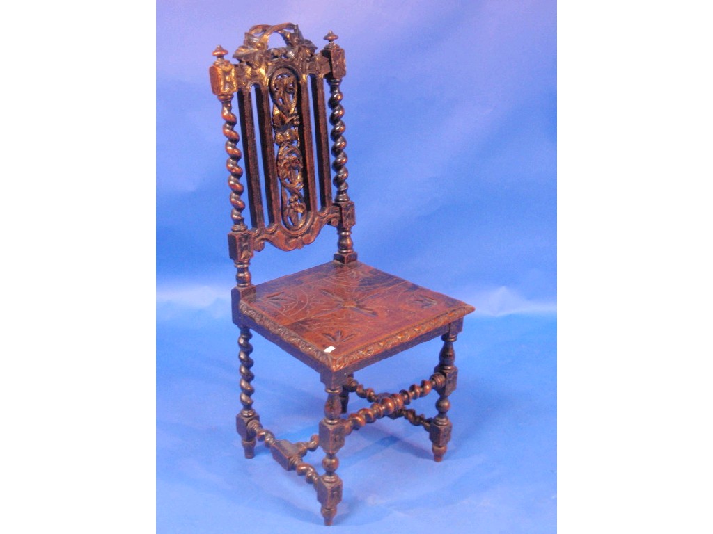 Appraisal: A late thC ebonised carved oak single chair with fruiting