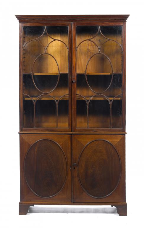 Appraisal: A GEORGE III MAHOGANY BOOKCASE with dentil cornice and fitted