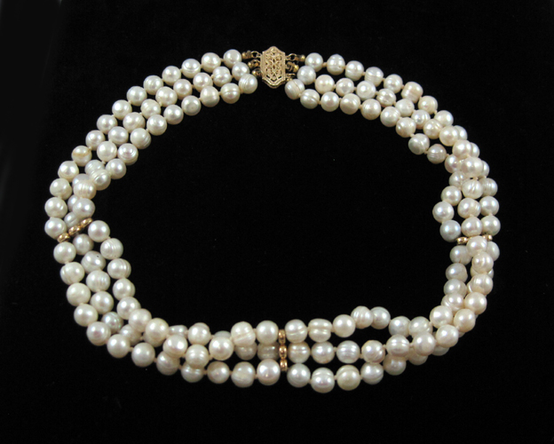 Appraisal: TRIPLE STRAND WHITE PEARL NECKLACE measuring - inches in length