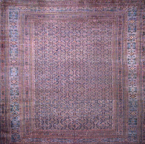 Appraisal: Persian Khorasson room-size rug with interlocking center panel and multiple