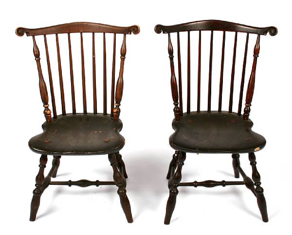 Appraisal: A pair of Windsor chairs with carved ears height in