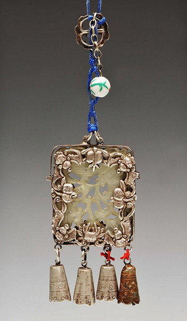 Appraisal: A CHINESE JADE PLAQUE pierced and carved flowers and mounted