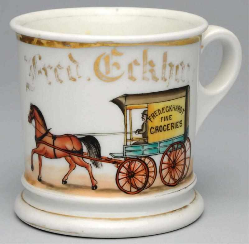 Appraisal: Horse-Drawn Grocery Wagon Shaving Mug Gilt name Fred Eckhardt Mug