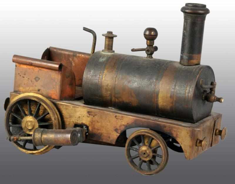 Appraisal: German Made Dribbler Steam Locomotive Description It includes a drain