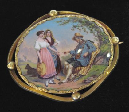 Appraisal: Yellow gold filled enameled tin broochPainted pastoral scene framed in