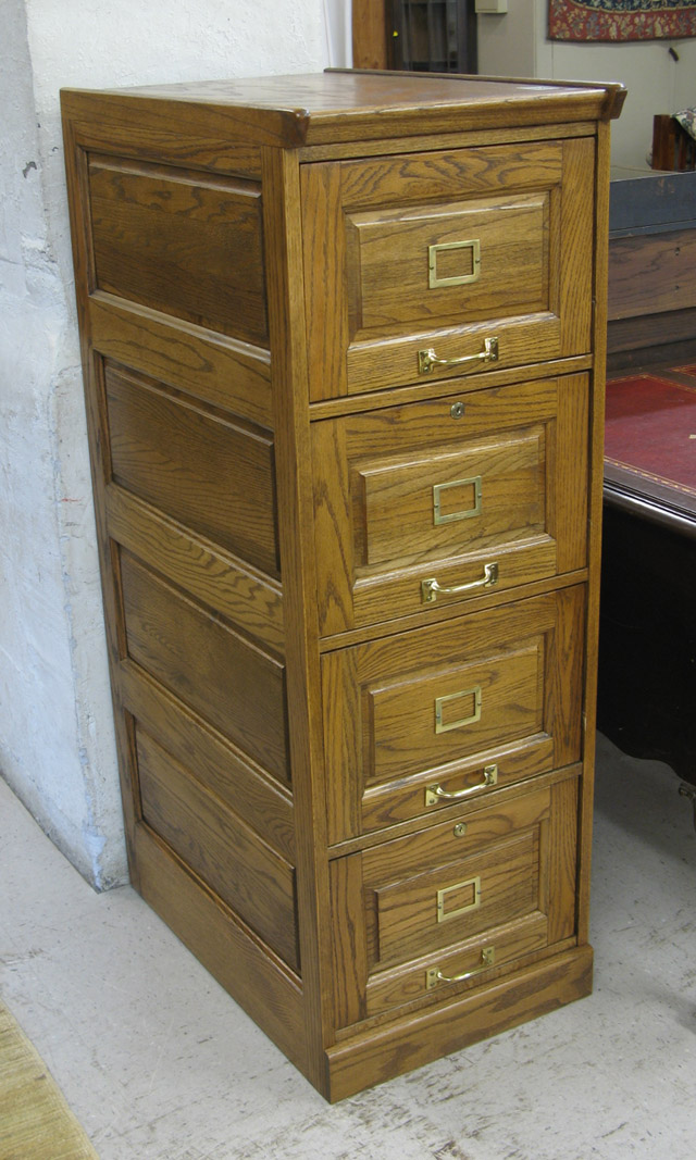 Appraisal: FOUR-DRAWER OAK FILE CABINET American antique reproduction featuring a column