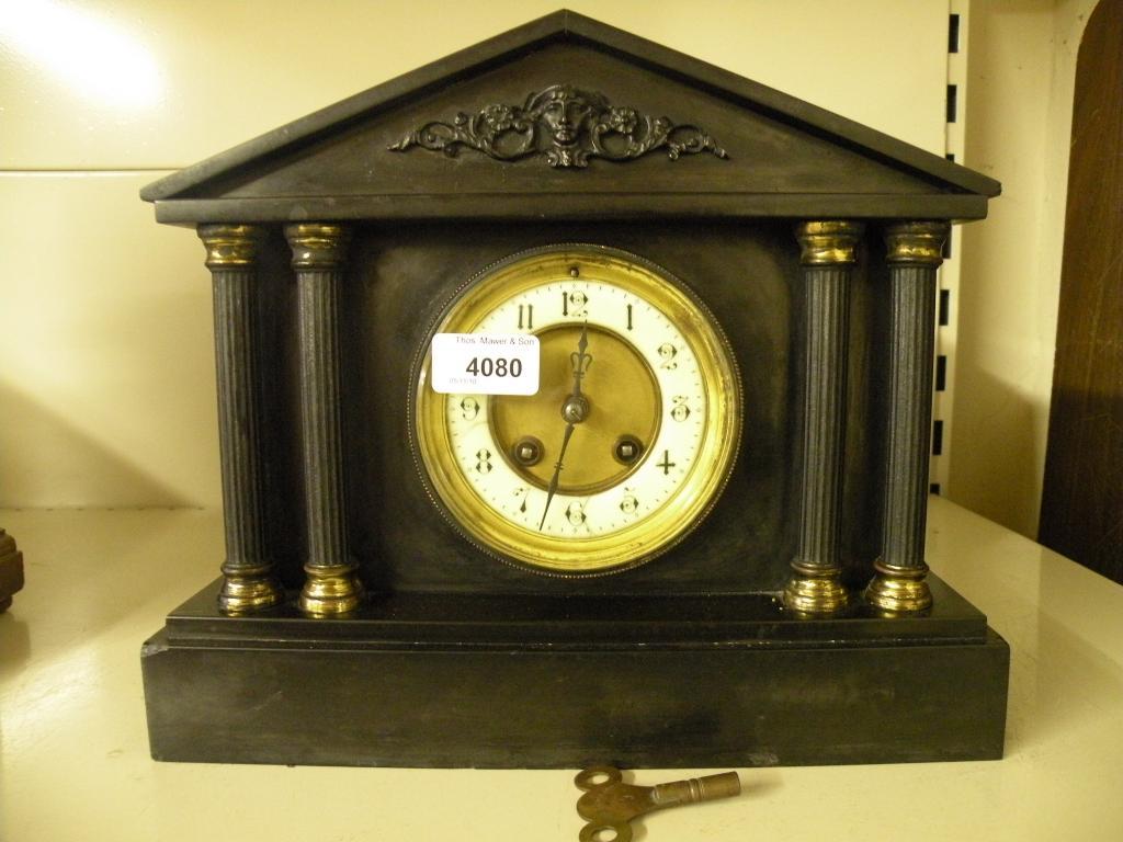 Appraisal: A late thC French black marble mantel clock in the