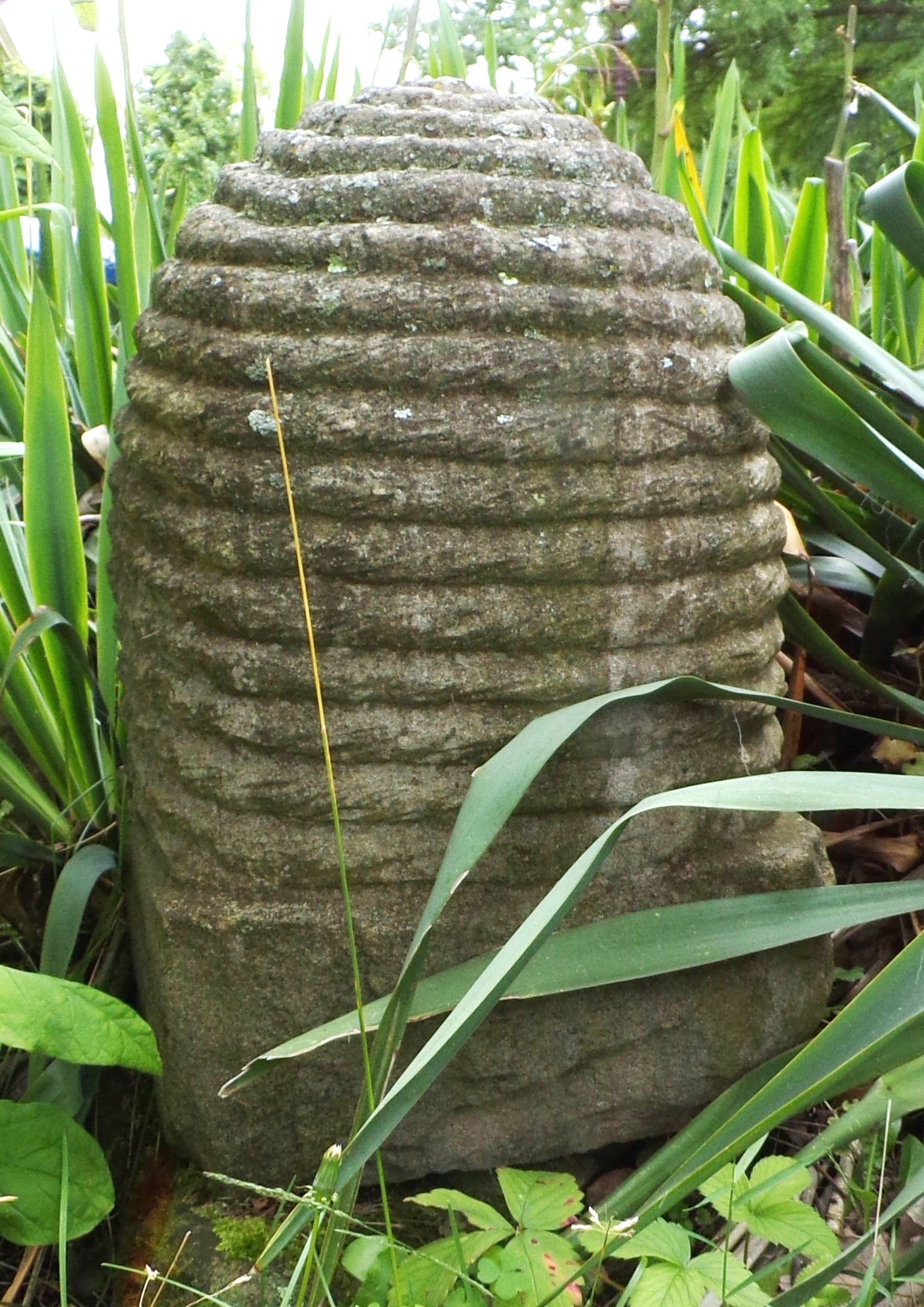 Appraisal: Carved stone bee skep some wear from the elements approximately