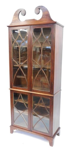 Appraisal: A mahogany bookcase with an arched pediment top above two