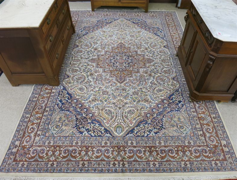 Appraisal: HAND KNOTTED ORIENTAL CARPET Indo-Persian floral and central floral medallion