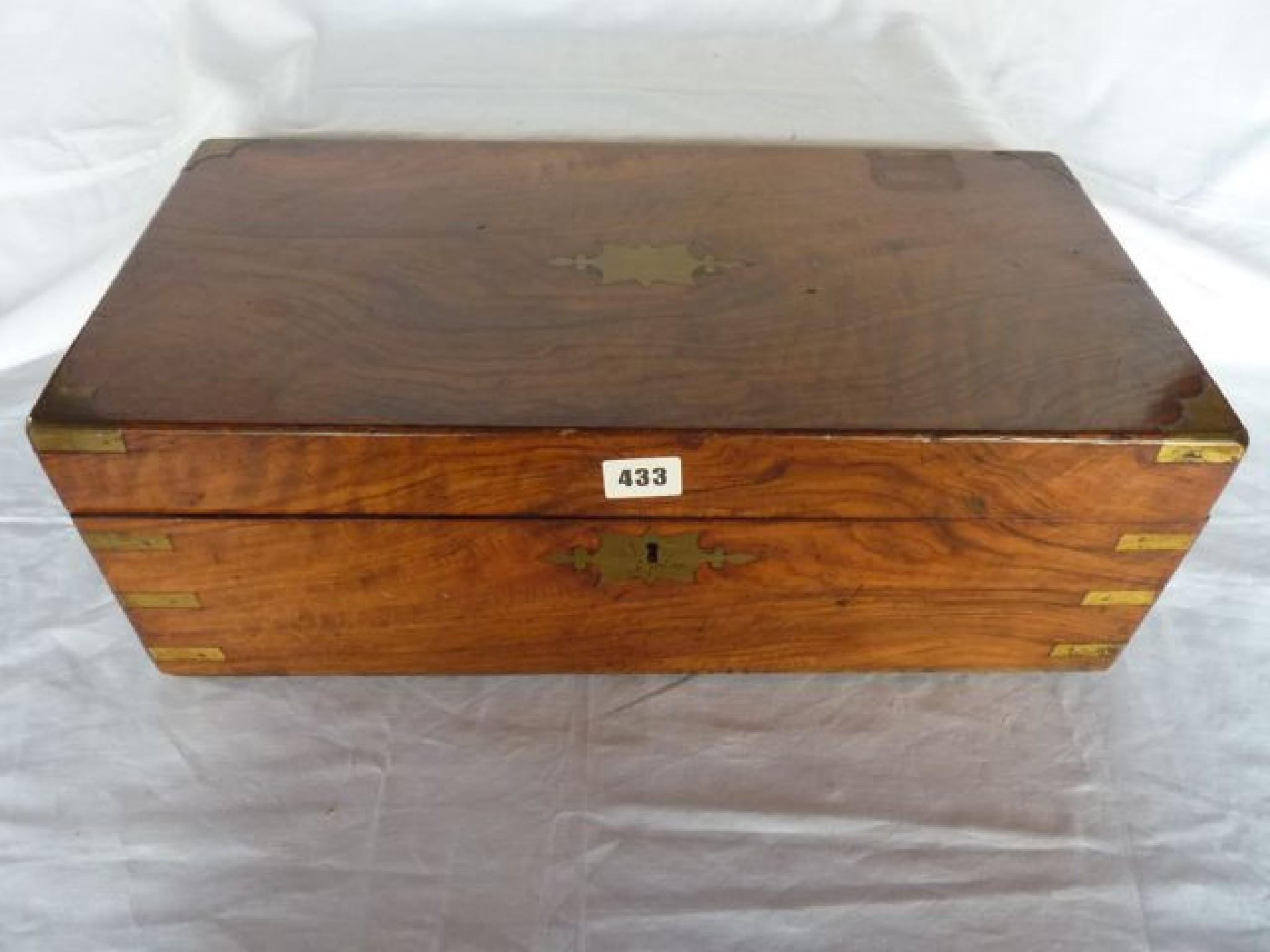 Appraisal: A Victorian walnut lap top desk with brass banded borders