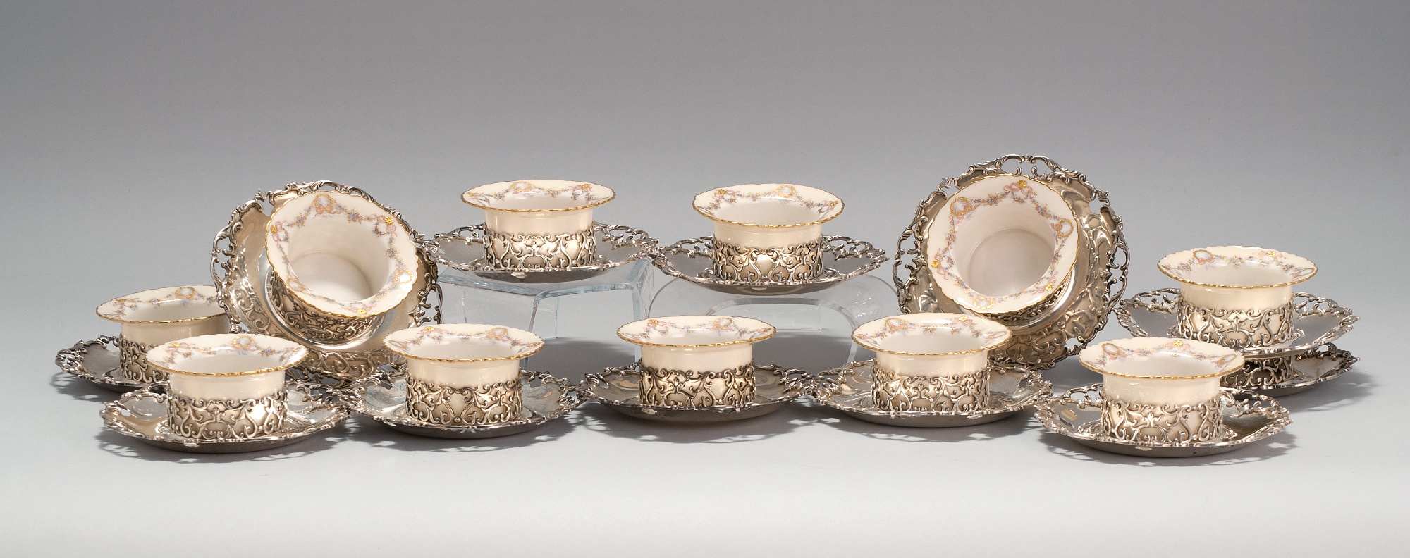 Appraisal: SET OF TWELVE STERLING SILVER RAMEKIN HOLDERS With eleven Lenox