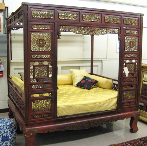 Appraisal: CHINESE GILTWOOD AND RED LACQUER CANOPY BED with custom mattress