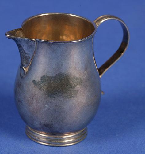 Appraisal: A GEORGE II SPARROWBEAK CREAM JUG of baluster form with