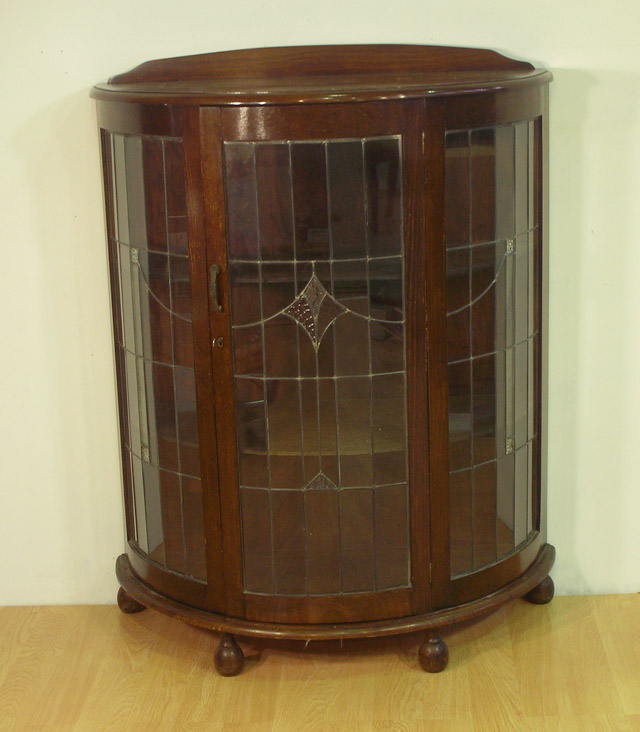 Appraisal: A th century demi-lune display cabinet together with another