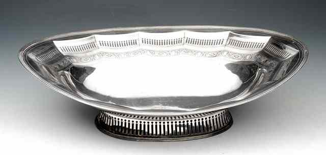 Appraisal: A GEORGE III OVAL SILVER BASKET decorated with pierced panels